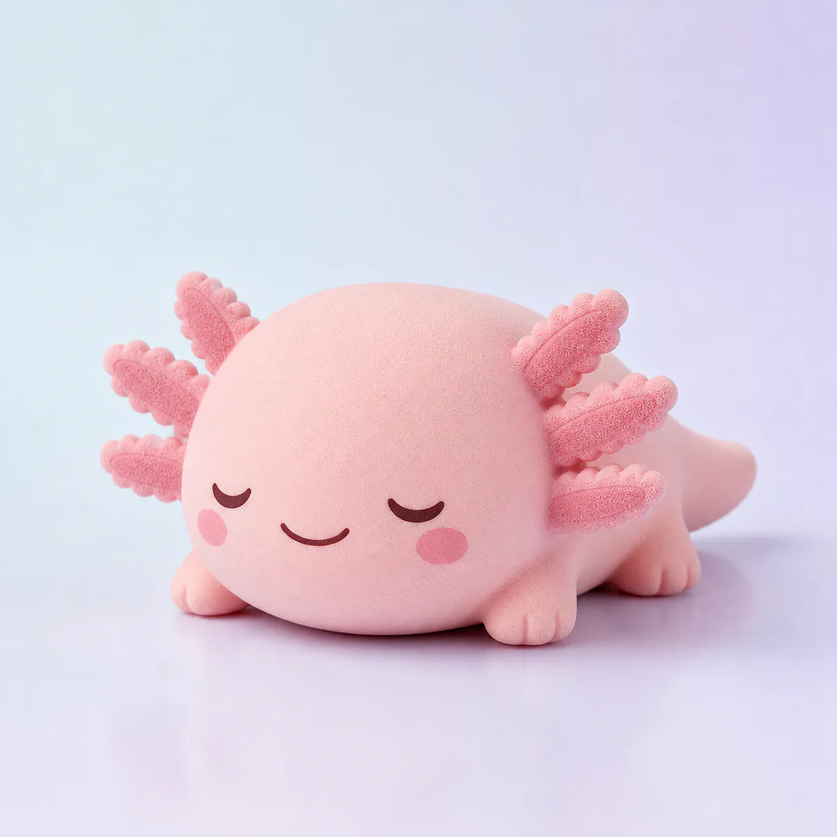 Axo Slow-Rise Squishy: blush axolotl foam toy on a soft pastel background