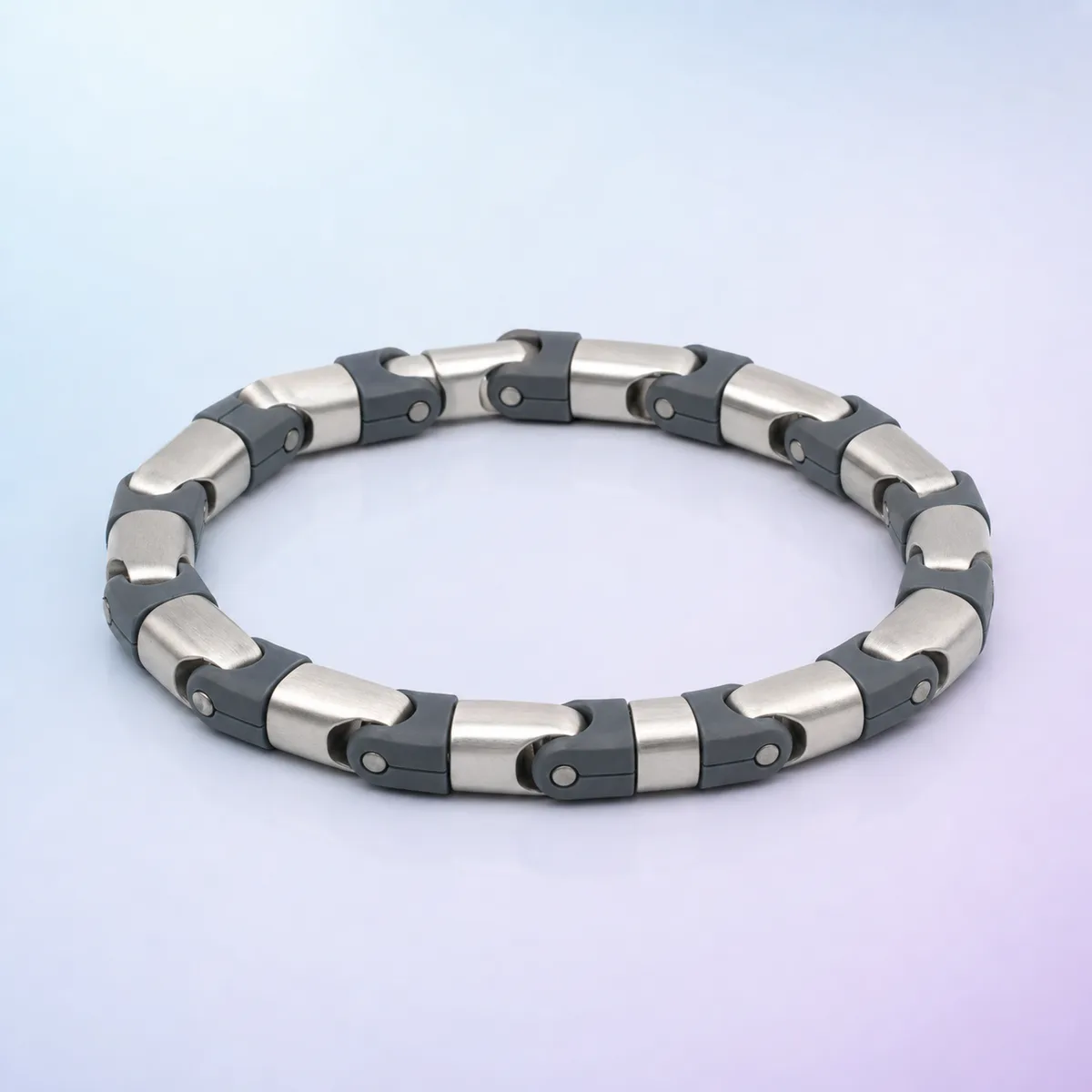 Roll & Flip Chain Fidget: silver and slate articulated loop on a soft pastel background