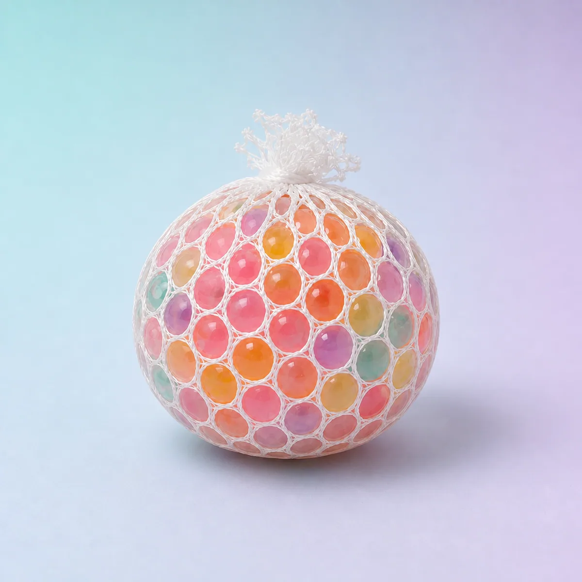 Calm Orb Water-Bead Squeeze Ball, Assorted shown on a soft pastel studio background